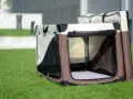 Składana klatka materiałowa dla psa, idealna na podróż lub jako bezpieczne miejsce w domu. Lekka i łatwa w transporcie.